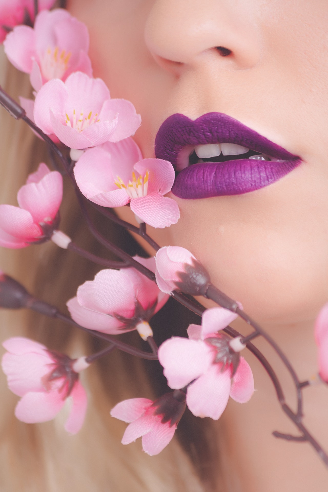 woman-showing-her-purple-lipstick